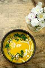Pumpkin and kale cream soup with sweet cream