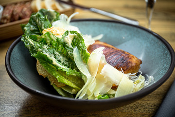 Roman lettuce salad with grilled chicken breast