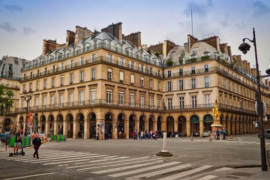 Paris buildings. Old Paris architecture, beautiful facade, typical french houses on sunny day. Famous travel destinations in Europe.