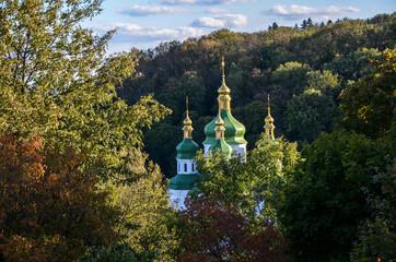 Fototapeta na wymiar View to the Vydubychi monastery and Left-Bank of the Dnipro river from the View from the Kyiv Botanical Garden