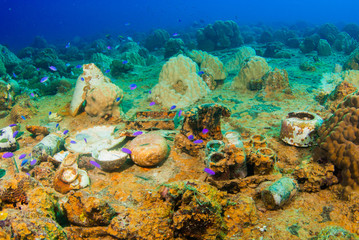 A variety of artifacts that can be discovered by scuba divers in a sunken ship. The vessel that held this cargo was a second world war Japanese ship that was sunk in Chuuk Lagoon during conflict