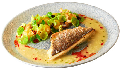 Grilled sea bass fillet with vegetable garnish