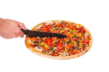 Man's hand with a knife cut the pizza, isolate on white background with clipping path, angle view....