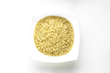 close up of white cup white rice layout on white isolated background. asian food and kitchen concept with copy space