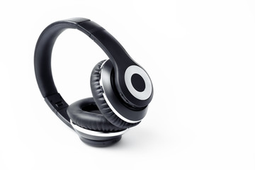 Black stylish professional wireless headphone on white background. High-quality music studio headset.