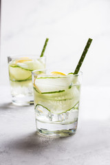 Nutritious detox water with lemon and cucumber in a pure glass. Healthy life concept.