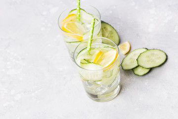 Nutritious detox water with lemon and cucumber in a pure glass. Healthy life concept.