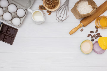 Fototapeta na wymiar Ingredients and utensil for baking on white background