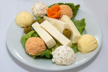 Serbian salad called Urnebes and cheese