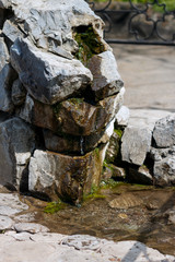 water spring in the Park, landscape composition, water runs over the stones