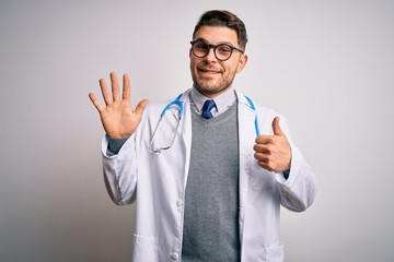 Young doctor man with blue eyes wearing medical coat and stethoscope over isolated background showing and pointing up with fingers number six while smiling confident and happy.