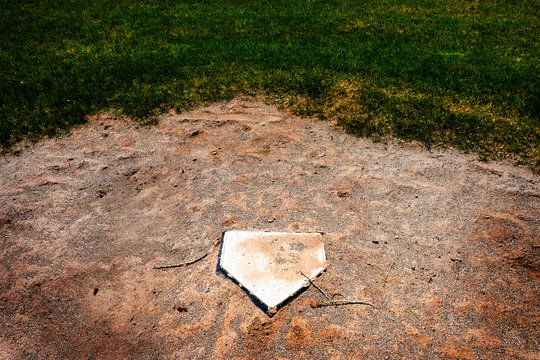 Abandoned Home Plate Baseball Field No Season due to Coronavirus Covid-19 - Powered by Adobe
