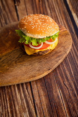 homemade hamburger on a wooden board. 