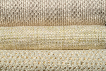 Catalog of fabric in white beige shades. Fabric sample. Industry background.