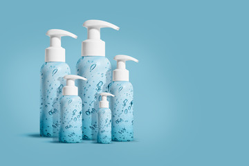 Large bottles in different sizes with hand sanitizer on a blue background for COVID-19. Coronavirus hygiene concept. Template. Banner