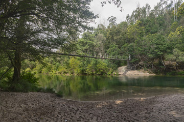 Wooden suspension bridge over the Verdugo river in Galicia