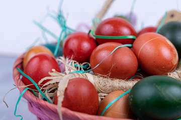 Closeup of colorful easter eggs in the basket
