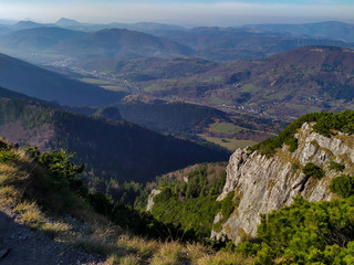 Obraz premium Janosik Diery, Slovakia - mountains nature landscape hills rocks trees meadows. Beautiful sunny day, clear blue sky. Wonderful views.