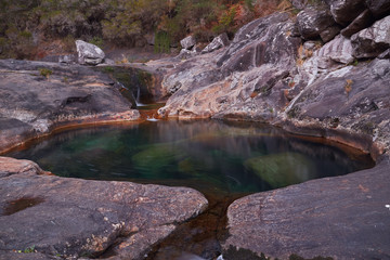 Natural pools formed by the erosion of the Pedras river, in Galicia, Spain.