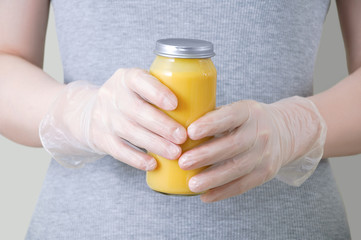 woman holding orange juice