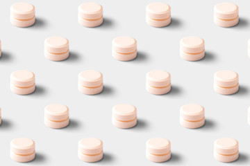Seamless pattern of pharmaceutical pills and vitamins on a white background. Orange pills on a white background.