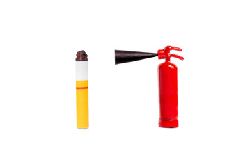 Miniature fire extinguisher close to a cigarette butt. Smoking and fire safety conept. Macro shot,...