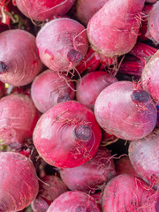 rew organic beetroot close up, natural red background.