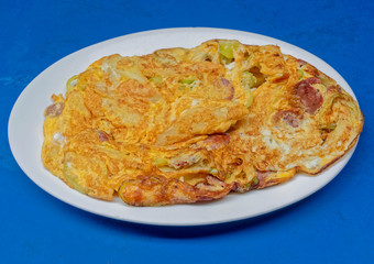 home made Greek omelette with sausage, feta cheese and sweet green pepper slices