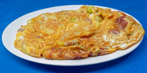 home made Greek omelette with sausage, feta cheese and sweet green pepper slices