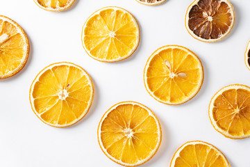 Fototapeta na wymiar Pattern of dried citrus oranges on a light background