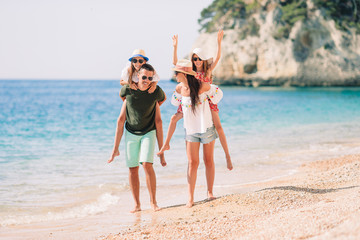 Photo of happy family having fun on the beach. Summer Lifestyle - 341045283