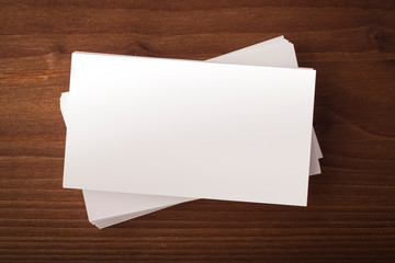 Blank business card on wooden background. business card for presentation of corporate identity. Top view