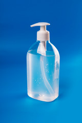 Alcohol Gel to prevention coronavirus. hand sanitizer soap. blue background
