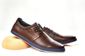 Men fashion brown shoe leather over white background. Pair casual stylish footwear.