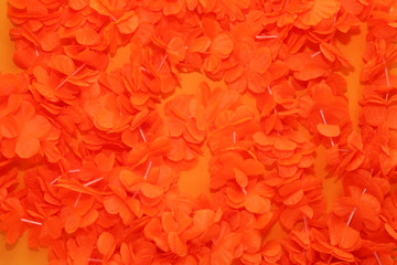 Orange background with typical King's Day accessories. 