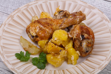 Roasted chicken legs with potato
