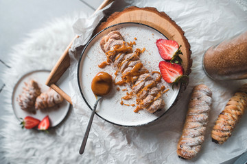 Walnut plaits with cinnamon and caramel sauce