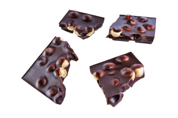 Dark chocolate with hazelnuts on a white isolated background