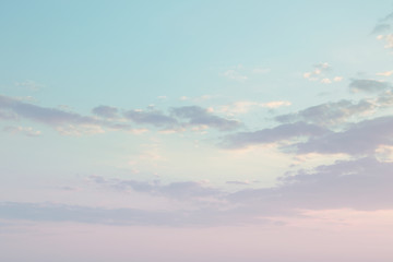 pastel pink blue evening sky with clouds