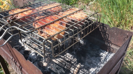 Pork steaks cooked on a charcoal grill outdoors