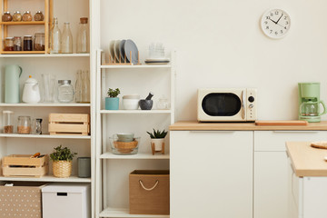 Warm toned background image of white kitchen interior with minimal design and wooden decor, copy space