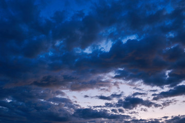 Naklejka na ściany i meble Sunrise on a background of Gray clouds