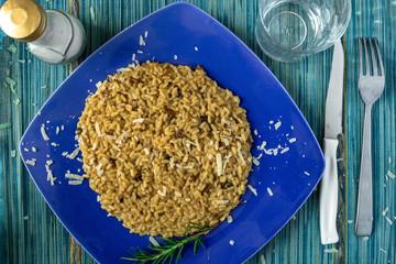 risotto with mushroom and parmesan on table