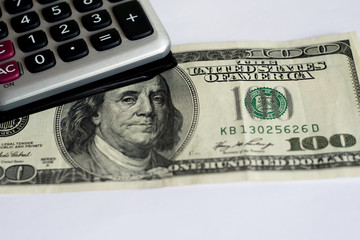 calculator on a white background, one hundred dollars usa