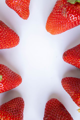 strawberry isolated on white with green leaves .