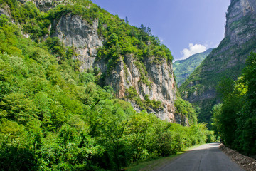 Fototapeta na wymiar a beautiful road among high mountains
