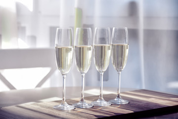 Four glasses of wine on a dining table