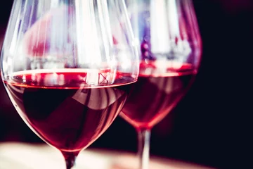Fotobehang Glasses of red wine, on a kouon table, red wine © sergantstar