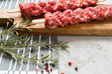 Raw turkish traditional meat kebab on the table. Close up.