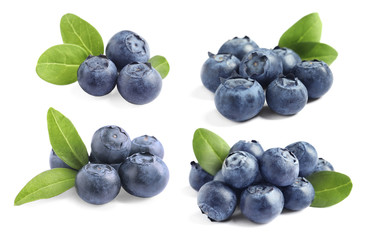 Set of tasty ripe blueberries with leaves on white background